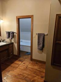 Bathroom includes a 1 person jetted tub and a separate walk in shower
