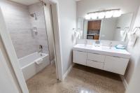 2-Compartment bathroom with double-sink vanity.