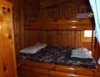 Cabin #4 - Bedroom includes full size bed with twin top bunk 