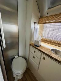 Bathroom with shower, hot water, towels 