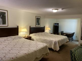 Two King size beds, table, chairs, refrigerator, microwave