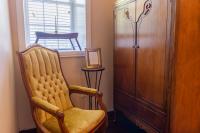 Captains chair and wardrobe in a cozy nook