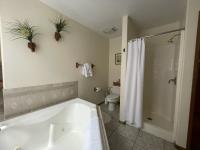 Full private bath with jacuzzi tub and separate shower