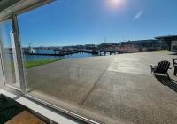 Overlooks the Westport Marina / grass & patio area
