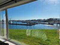 Overlooks the Westport Marina / grass & patio area